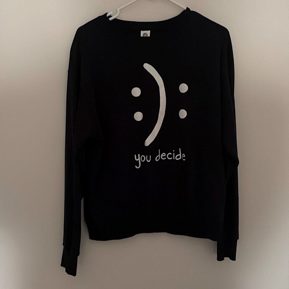 You decide cute size medium black crew neck with white design.